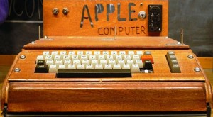 A fully assembled 1976 Apple I computer, with a homemade wooden computer case.