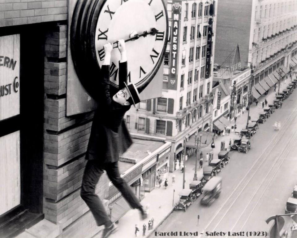 Harold Lloyd Safety Last 1923 comedy movie hanging clock skyscraper stunts  Broadway Los Angeles city black&white