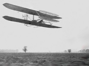 Wilbur Wright flying airplane 4 circles of Huffman Prairie, flight 82 in 1904 (Photo Wright Brothers)