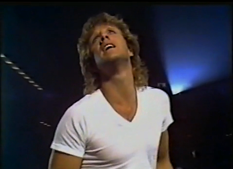 Darryl Cotton Australian singer singing music video 1980 white T-shirt 80s blonde hair-cut cinema