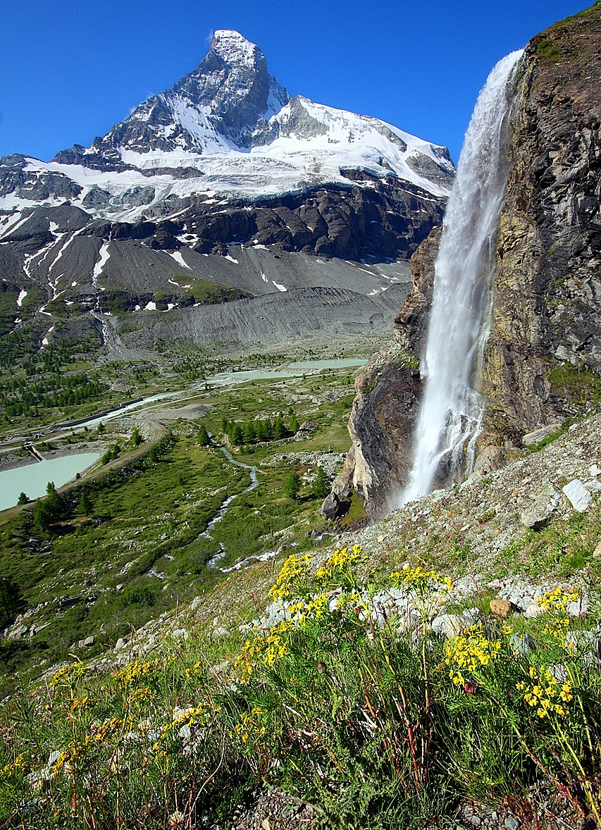 Matterhorn Zmutt valley snow mountain waterfall alpine flowers Alps Switzerland Italy