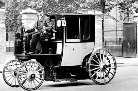 London Taxi 1897 electric cab Bersey Taxis UK 1st licensed propelled vehicle car driver road spoked wheels black & white