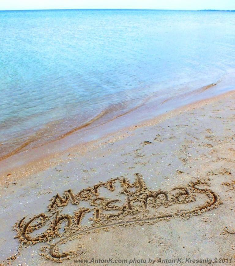 Merry Christmas beach writing in sand Chelsea Melbourne Australia Edithvale Port Phillip Bay ocean water sea Xmas